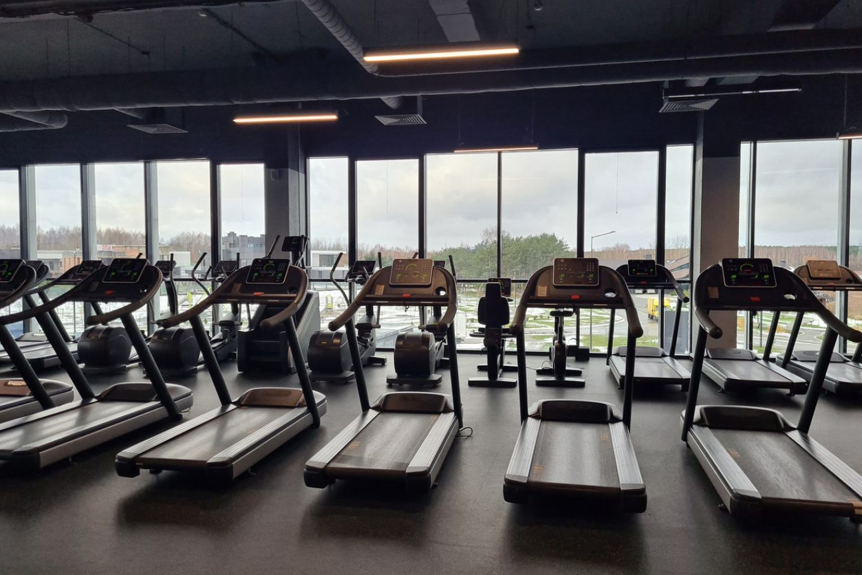 Row of sports equipment in fitness gym